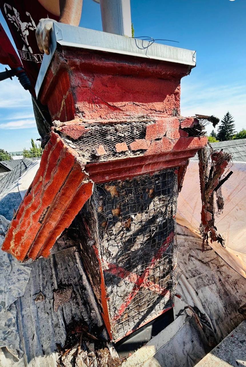 Damaged chimney stucco removed during Calgary repair project