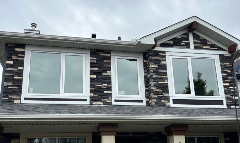 Finished exterior with replacement windows and a new dark panel design
